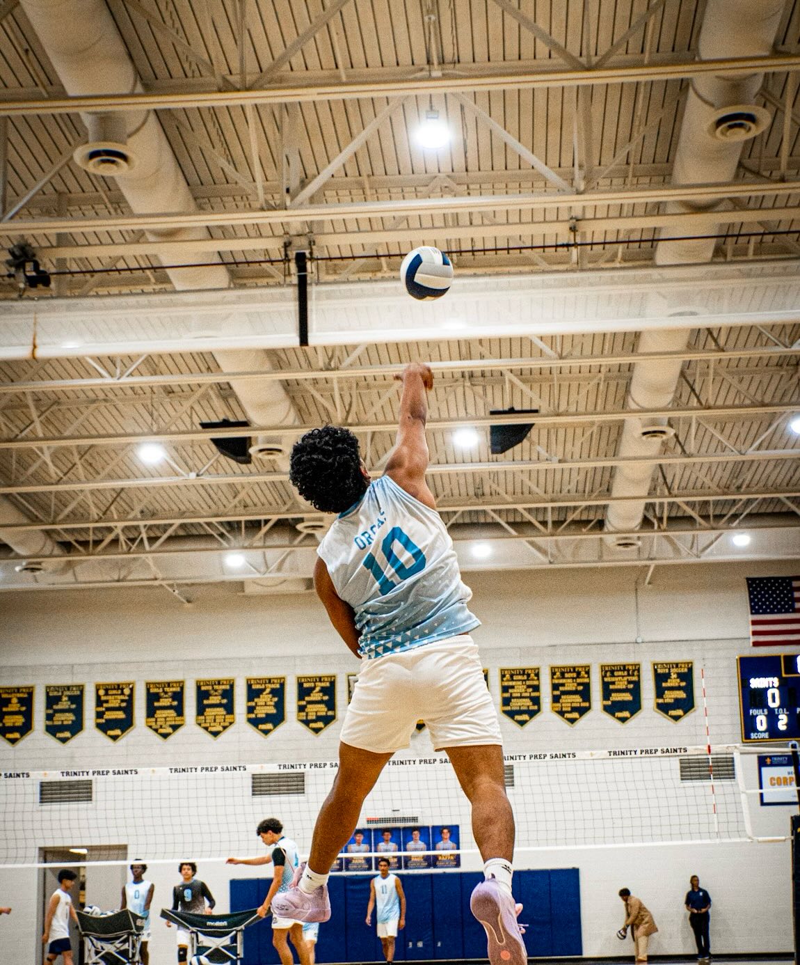 Volleyball player mid-jump